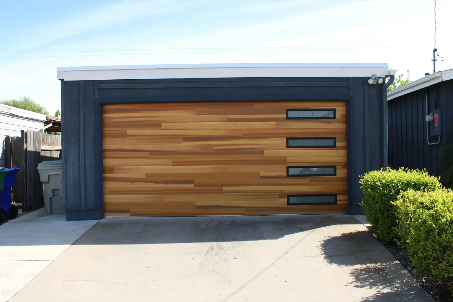 Modern garage door with timber-look panels